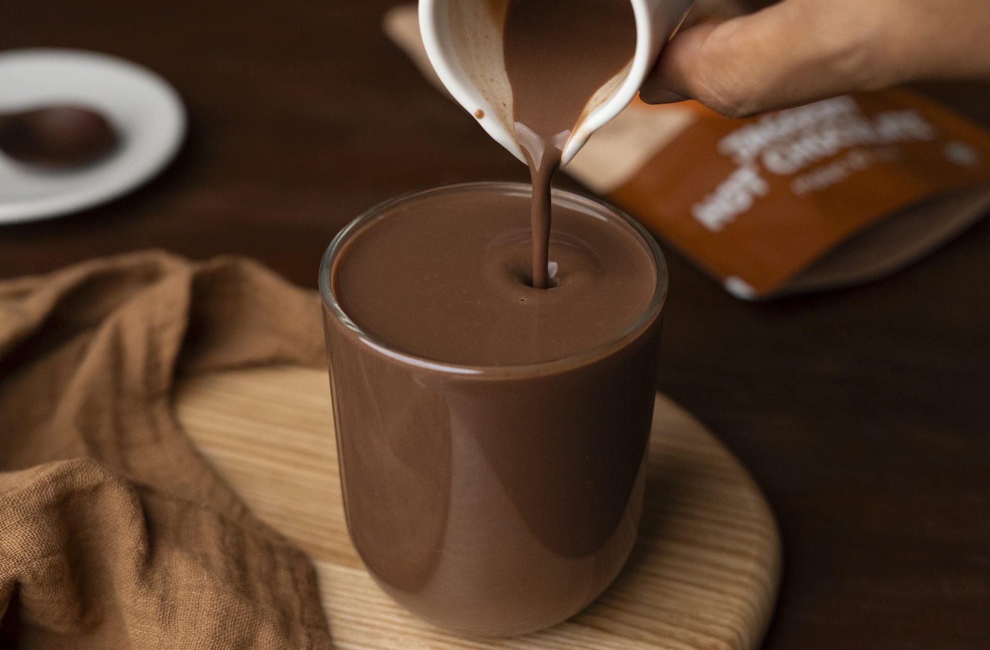 Iced chocolate being poured into a glass